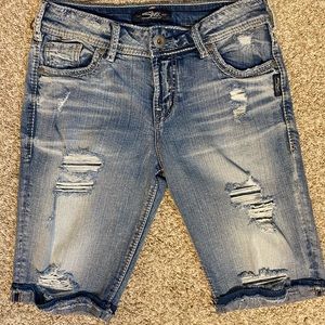 Silver Bermuda shorts.